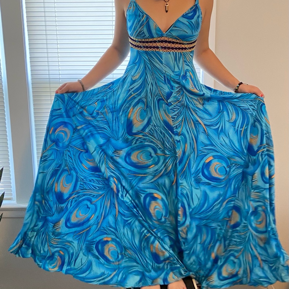 Never worn; long full dress. Fitted top
